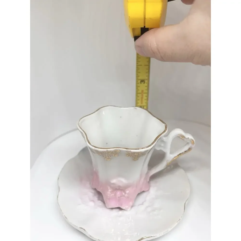 Antique Footed Teacup And Saucer